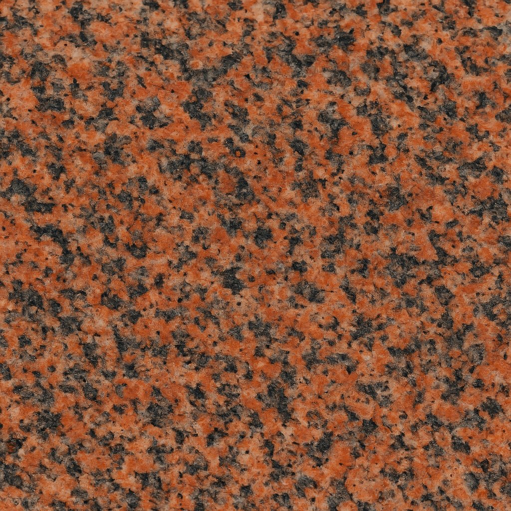 Granito rojo intenso con vetas negras, ideal para fachadas, cocinas y baños.